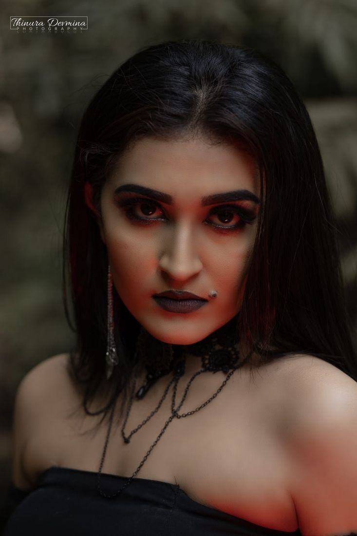 Dramatic gothic portrait with crimson eyes