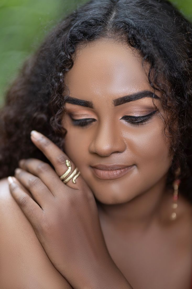 Close-up beauty portrait with a gold serpent ring
